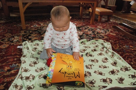 Asher looking at the book